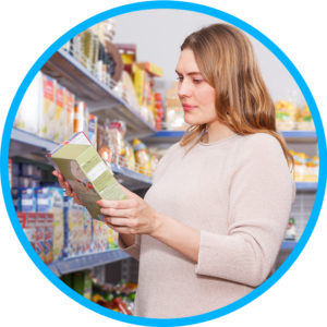 Woman looking at food label in store